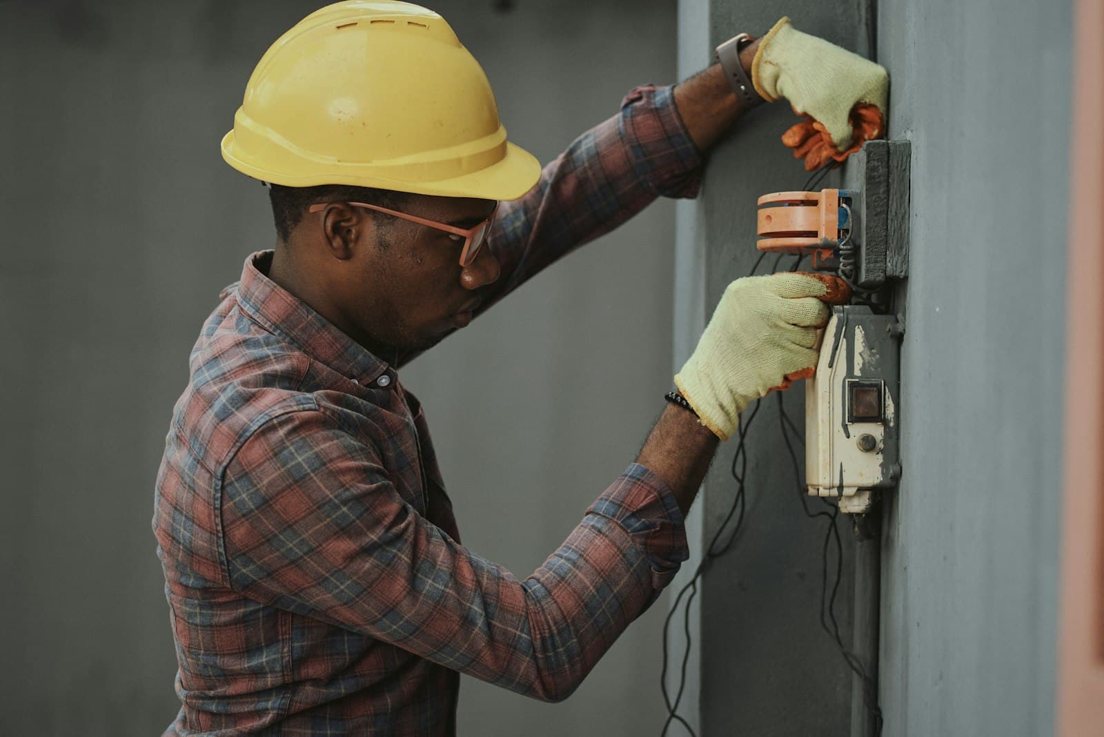 Worker grinding metal with sparks flying